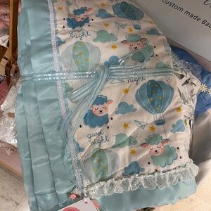 Handmade Baby quilt,crib size cotton and cotton flannel with satin trim